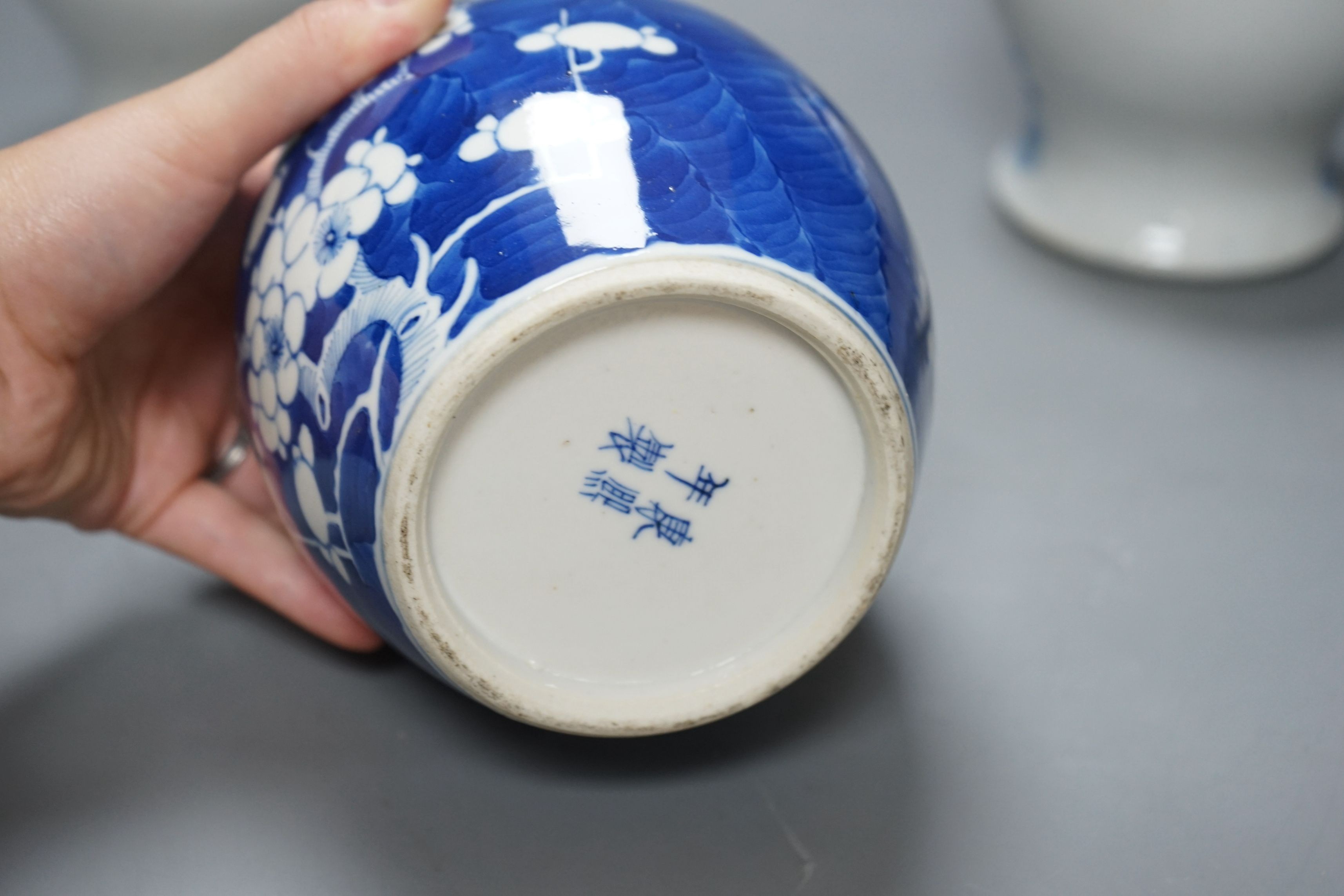 A pair of Chinese jars and covers and a prunus jar and cover circa 1900, jars and covers 21cms high